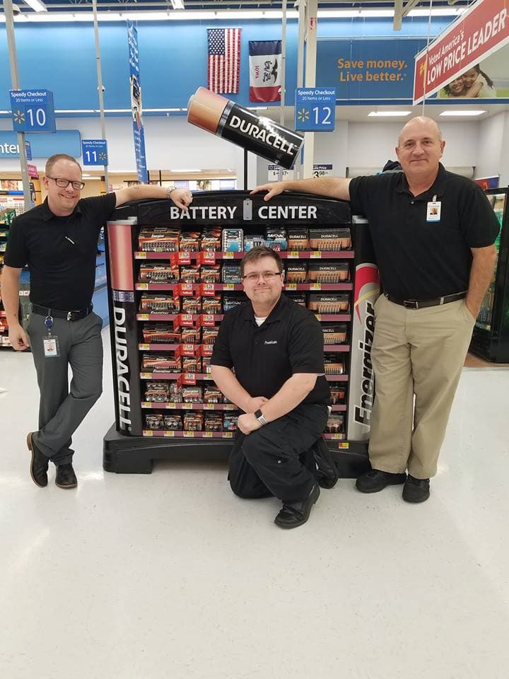 Premium Walmart team members with a Duracell display