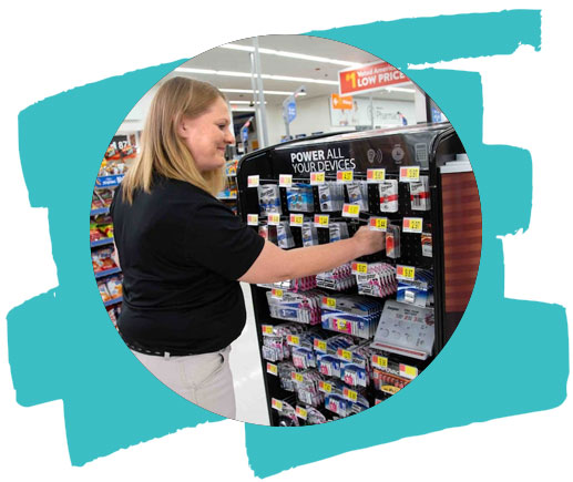 Merchandising team member works on a display